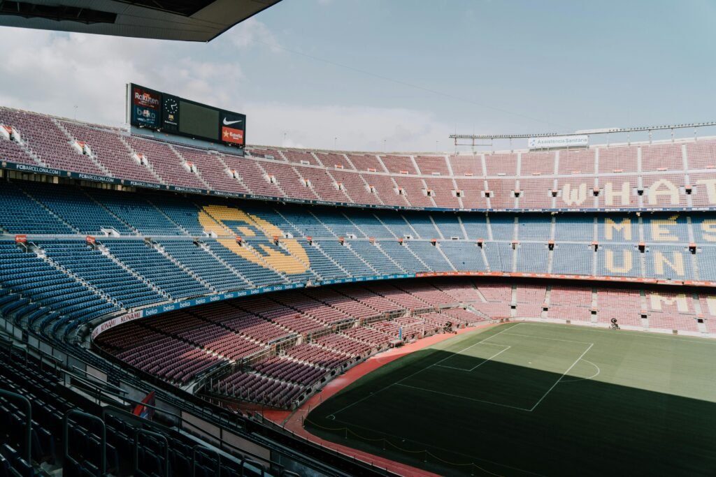 View of Camp Nou stadium in Barcelona, showcasing the iconic stands and field.